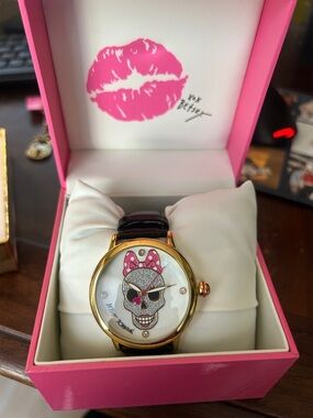 Betsey Johnson Pink Bow Skull Watch with Gold-Tone Case and Black Strap